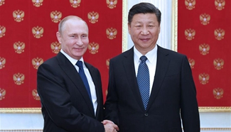 Xi, Putin agree to boost coordination on major issues