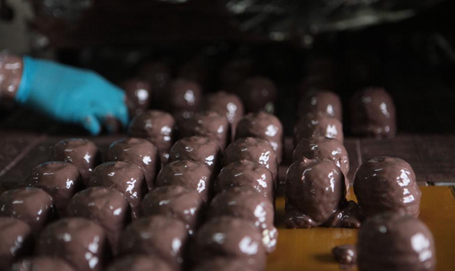 Palestinian workers make chocolate Ras el-Abd in West Bank city