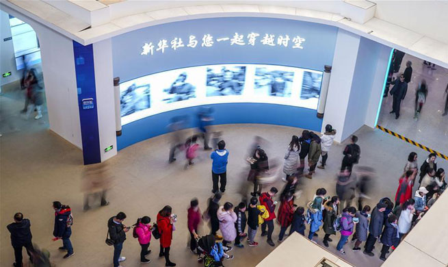 Visitors view exhibition commemorating China's reform and opening-up